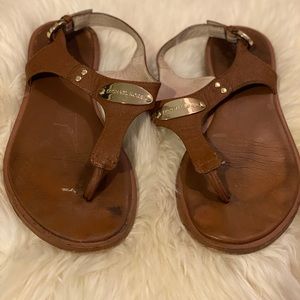 Luggage MK Plate Flat Thong Sandals